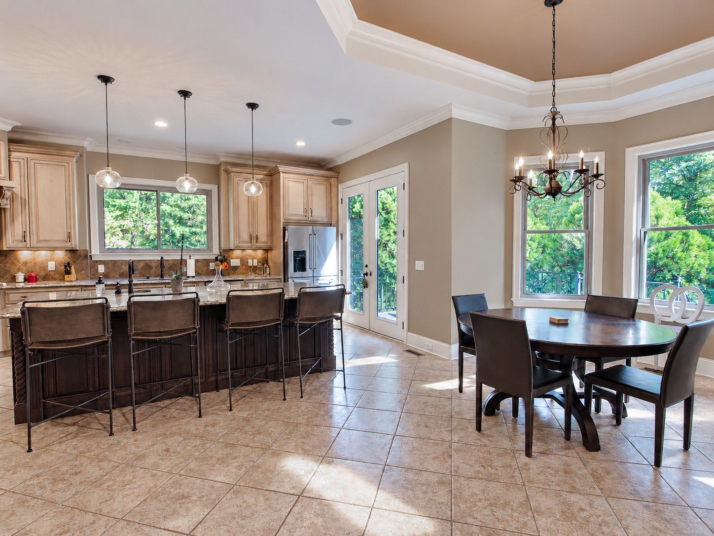 Kitchen and dining area with chandelier and French doors